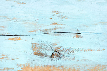 Blue vintage painted natural wooden background with knots and cracks .