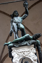 Florence, Italy - Perseus defeats Medusa sculpture, made by Benvenuto Cellini and located in Loggia dei Lanzi, in Piazza della Signoria