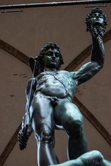 Florence, Italy - Perseus defeats Medusa sculpture, made by Benvenuto Cellini and located in Loggia dei Lanzi, in Piazza della Signoria