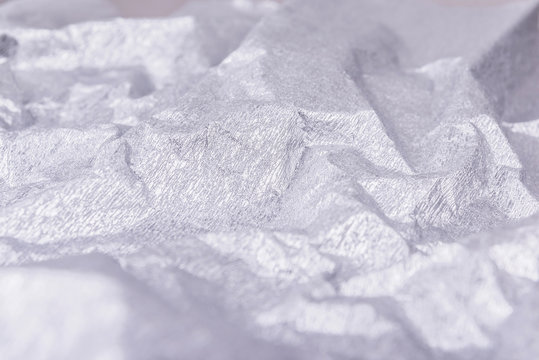 Crumpled Silver Wrapping Paper With Shiny Effect.