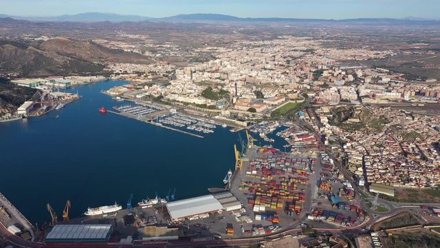 Commercial harbour and the city of Cartagena Spain sunny day aerial view 
