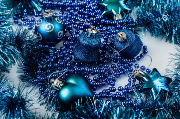 Winter holidays composition. Close up.Modern design Christmas tree decorated with balls and garlands - navy blue, brown, beige. Toys for the new year.