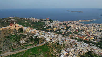 Aerial drone photo of iconic uphill catholic settlement of ano Syra featuring church of Saint George with beautiful colours, Syros or Siros island, Cyclades, Greece
