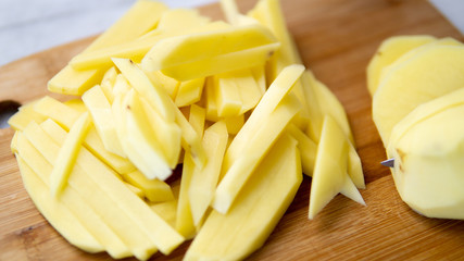 chopped potatoes as fry on cutting board