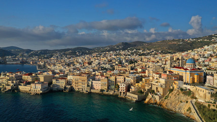 Fototapeta na wymiar Aerial drone photo of picturesque district built by the sea of Vaporia in main town of Syros or Siros island Ermoupolis and famous church of Agios Nikolaos, Cyclades, Greece