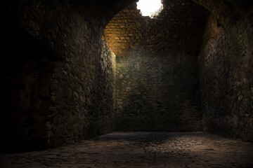 Interesting View from the inside of a dark room dungeon, with natural light entering from outside