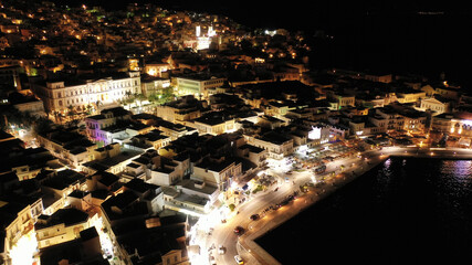 Aerial drone night shot of neoclassic landmark building of Ermoupolis town city hall in Miaouli square, Syros or Siros island, Cyclades, Greece