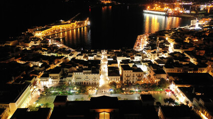 Aerial drone night shot of neoclassic landmark building of Ermoupolis town city hall in Miaouli square, Syros or Siros island, Cyclades, Greece