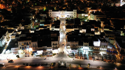 Aerial drone night shot of neoclassic landmark building of Ermoupolis town city hall in Miaouli square, Syros or Siros island, Cyclades, Greece