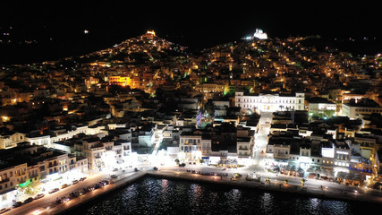 Aerial drone night shot of neoclassic landmark building of Ermoupolis town city hall in Miaouli square, Syros or Siros island, Cyclades, Greece