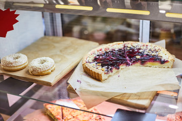 Berry tart on a pastry shop window