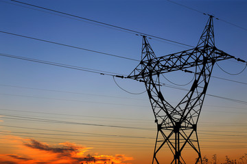 High voltage tower, silhouetted in the evening