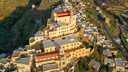 Fototapeta na wymiar Aerial drone photo of iconic uphill Catholic settlement of ano Syra featuring church of Saint George at sunset with beautiful colours, Syros or Siros island, Cyclades, Greece