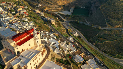 Aerial drone photo of iconic uphill Catholic settlement of ano Syra featuring church of Saint...