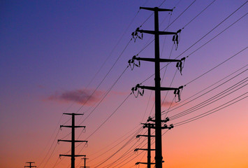 High voltage tower, silhouetted in the evening