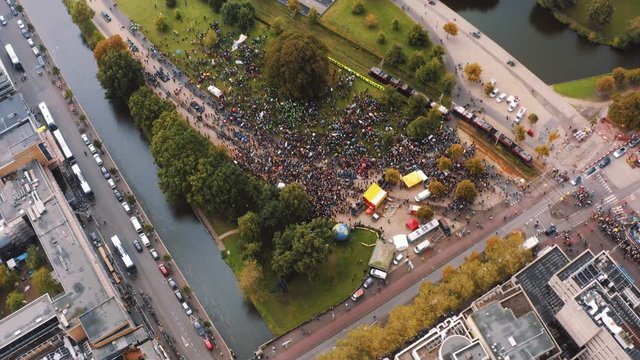 Drone pan and tilt up of the Hague during climate change strike 
