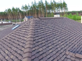 Fototapeta premium Bituminous tile for a roof. House with a roof from a bituminous