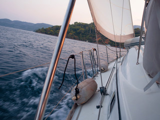 Tailwind, the concept of moving forward on all sails. Boat trip on a yacht under sail,