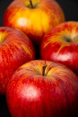 red apples on black background