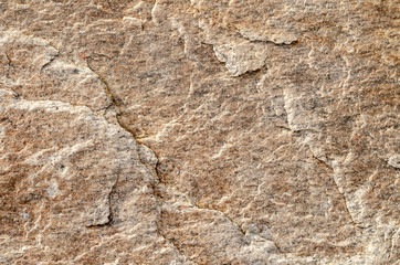 Layered surface of granite boulder