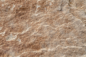 Textured surface of granite boulder