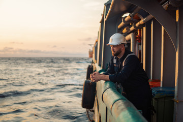 Marine Deck Officer or Chief mate on deck of offshore vessel or ship , wearing PPE personal...