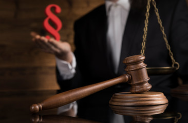 Justice and law concept, Male judge in a courtroom striking the gavel