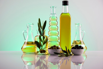 Olive oil bottles, olive branch and Cooking oils