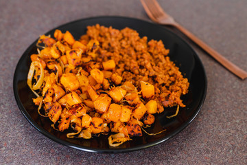 vegan mince bolognaise with sauteed butternut squash cubes with balsamic vinegar