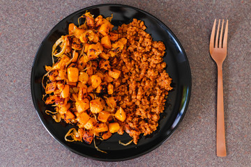 vegan mince bolognaise with sauteed butternut squash cubes with balsamic vinegar