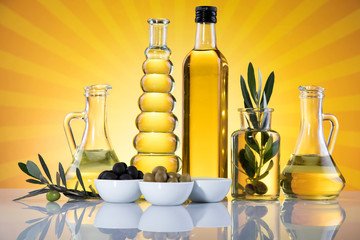 Olive oil bottles, olive branch and Cooking oils