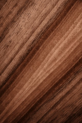 The texture of a wooden board closeup. Defocused background.