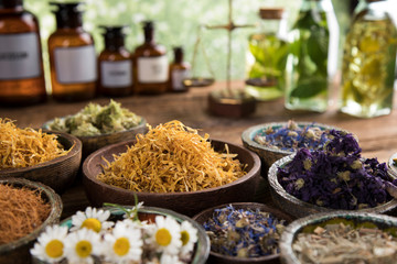 Herbs medicine and vintage wooden background