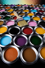 Tin cans with paint and brushes