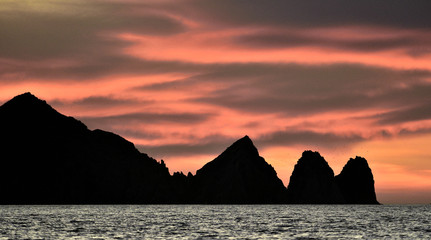 Beautiful Sunset of Seascape with Mountains silhouets. Sea off the Coast of Cabo San Lucas. Gulf of California (also known as the Sea of Cortez, Sea of Cortes. Mexico.