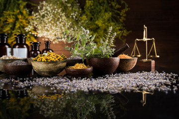 Natural medicine in black mirror background