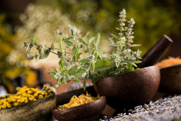 Natural medicine in black mirror background