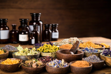 Herbs medicine and vintage wooden background