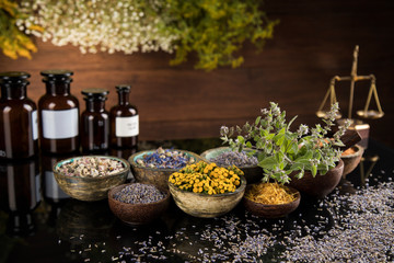 Natural medicine in black mirror background