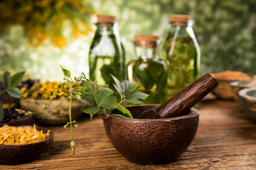 Herbs medicine and vintage wooden background - 306274384