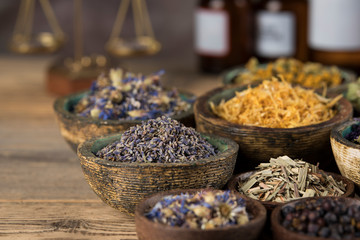 Herbs medicine and vintage wooden background