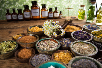 Herbs medicine and vintage wooden background
