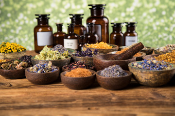 Obraz na płótnie Canvas Natural remedy,Herbal medicine and wooden table background