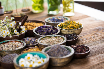 Herbs medicine and vintage wooden background