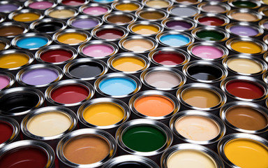 Group of tin metal cans with color paint