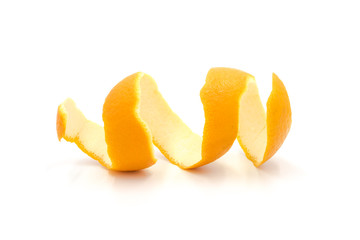 Fototapeta na wymiar Slice of curly fresh orange peel closeup isolated on white background
