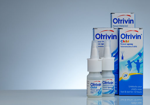 CHONBURI, THAILAND-NOVEMBER 11, 2018 : Otrivin nasal metered dose spray. Xylometazoline for unblocks nose fast and lasts for 12 hours. Nasal spray in drug bottle container on gradient background.