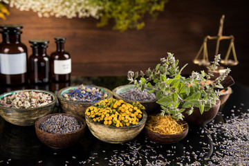 Natural medicine in black mirror background