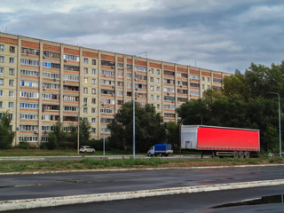 Obraz premium Old soviet apartment building. Ust-Kamenogorsk (Kazakhstan). Old residential area. Soviet style. Parking. Trailer
