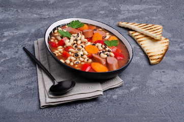 Stewed beans with sausages